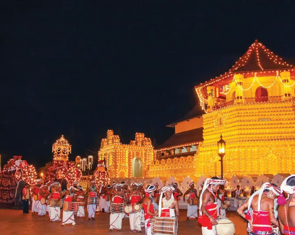 The Kandy Esala Perahera procession in front of the Temple of the Tooth